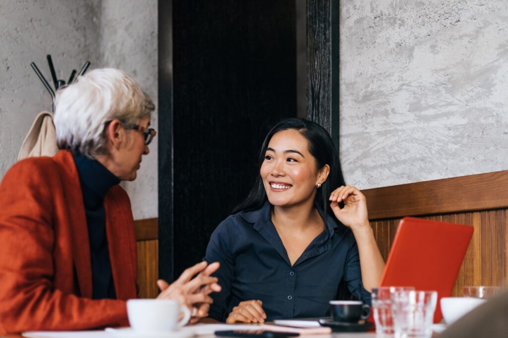 Two Women Having Meeting In Restaurant