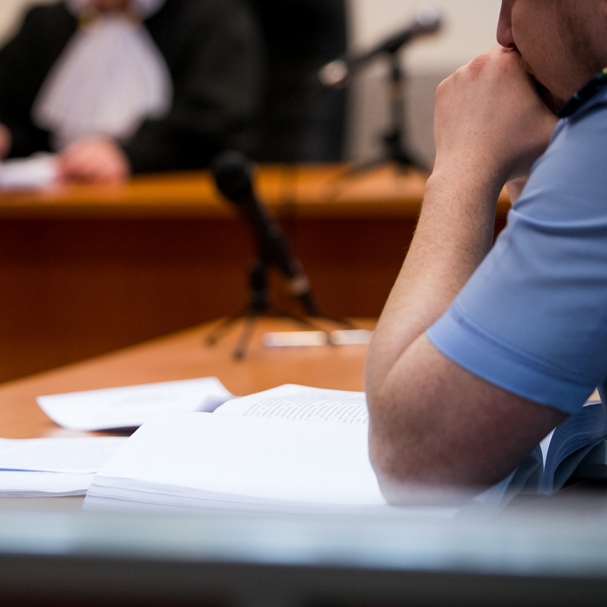 Person sitting in immigration court, due process